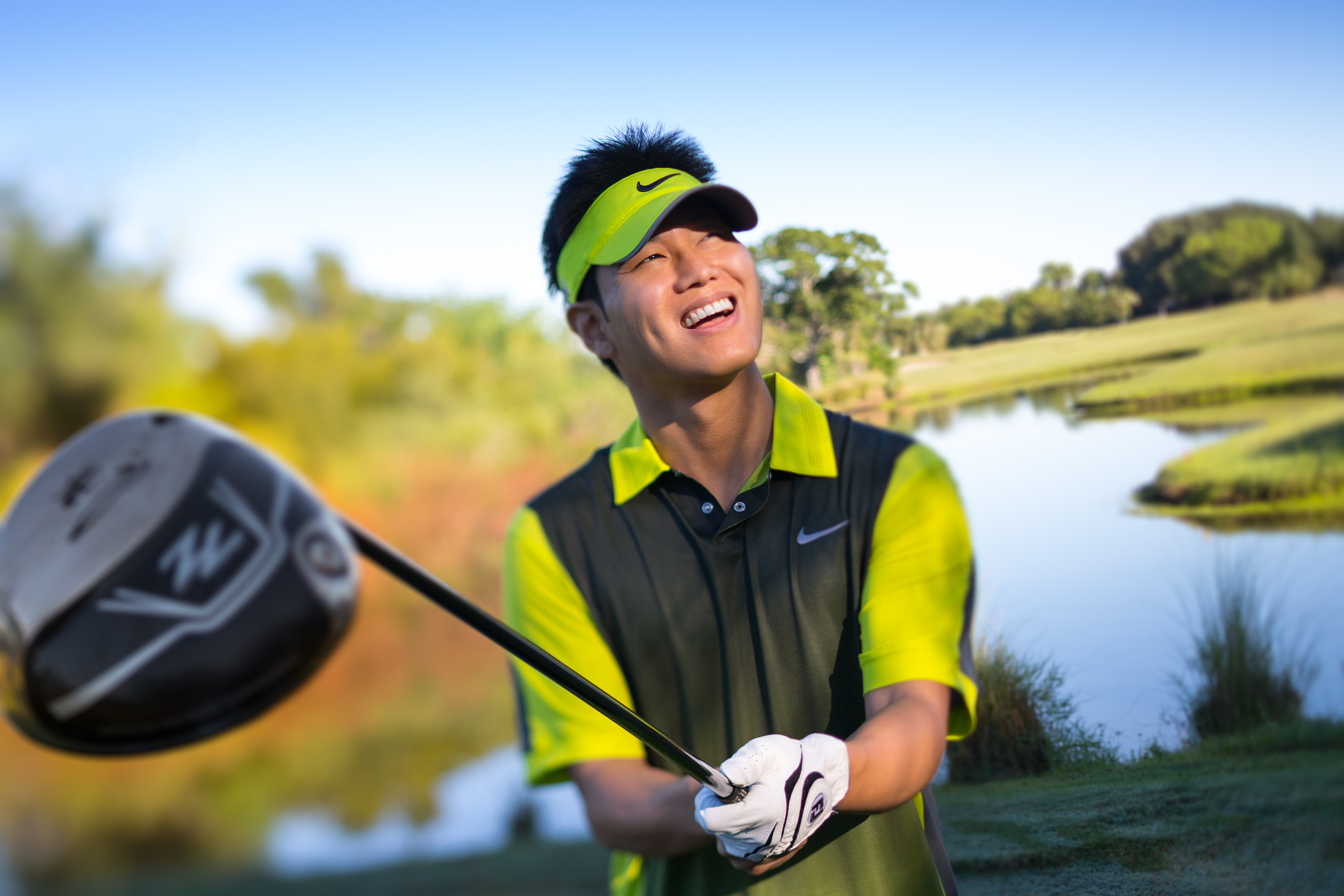 Young Asian man golfing, shot by Steven P. Widoff